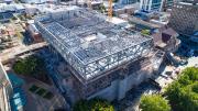 Steel work of the new building sits above the heritage buildings 